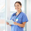 Shot Of A Young Nurse Using A Tablet In A Office